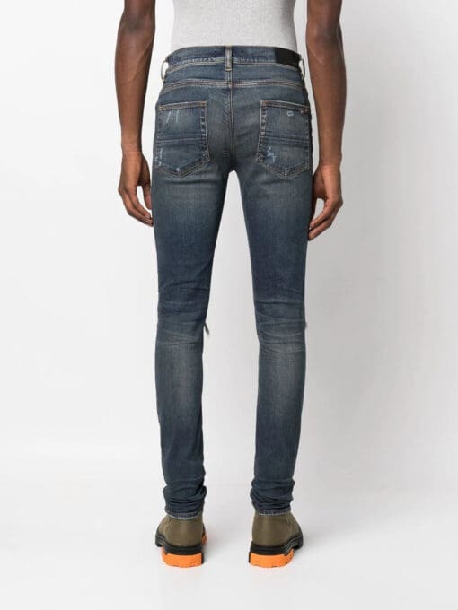 Amiri distressed panelled skinny jeans - Image 4