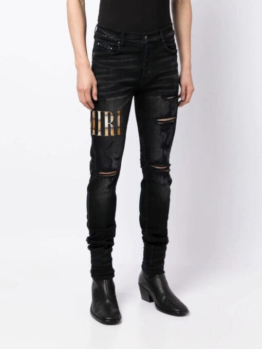 Amiri appliqué-logo distressed-effect slim-fit jeans - Image 3