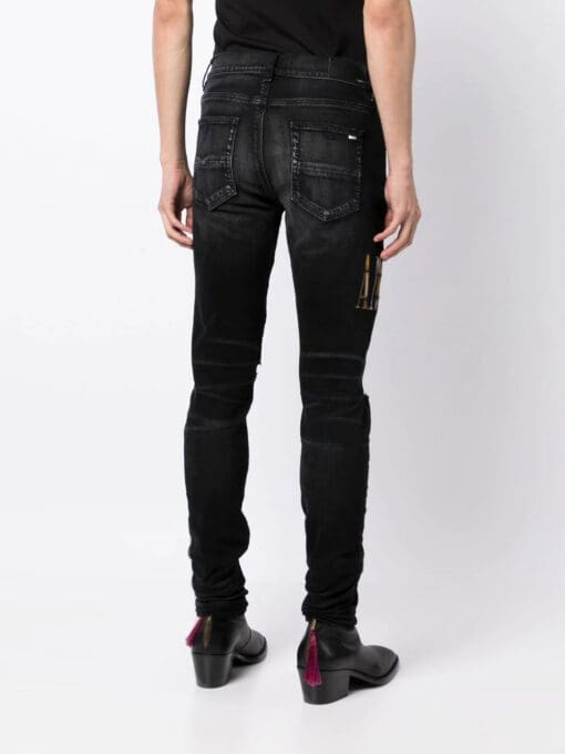 Amiri appliqué-logo distressed-effect slim-fit jeans - Image 4