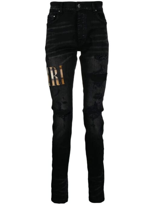 Amiri appliqué-logo distressed-effect slim-fit jeans