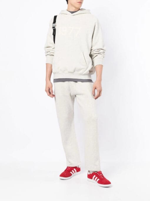 FEAR OF GOD ESSENTIALS  '1977' print hoodie - Image 2