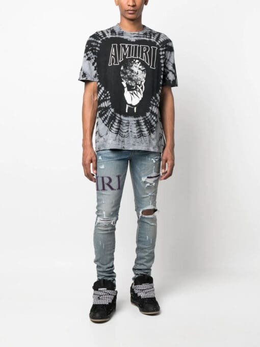 AMIRI  ripped-knee logo-print skinny jeans - Image 2