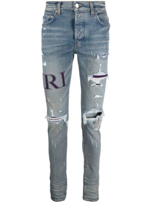 AMIRI  ripped-knee logo-print skinny jeans